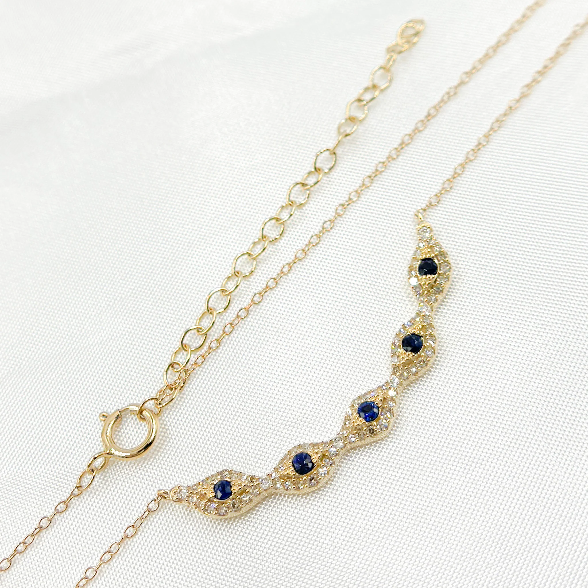 NFE70852BS. 14k Solid Gold Diamond and Blue Sapphire Eye Necklace