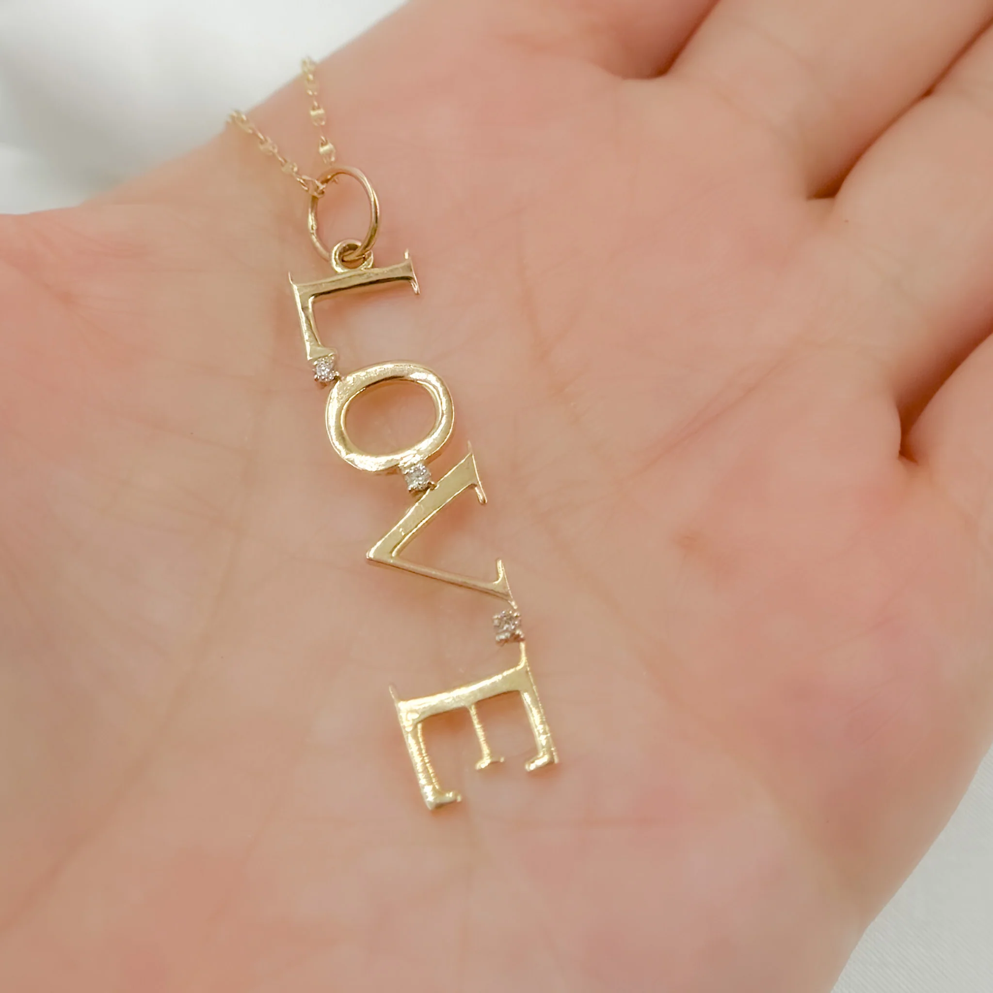 GDP25. 14k Solid Gold Diamond Love Word Charm